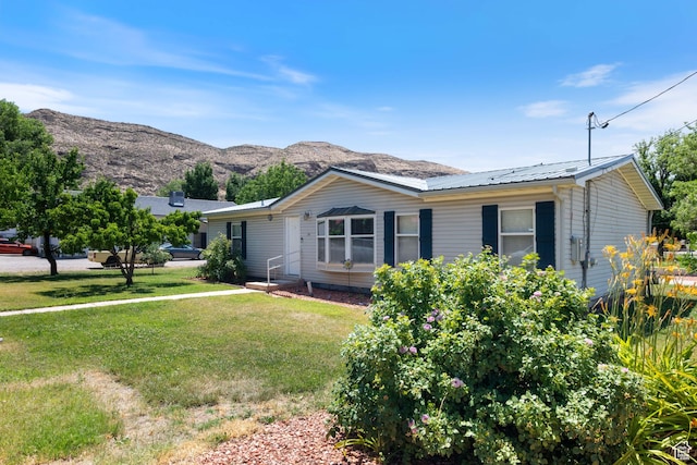 10 E 200 N, La Verkin, UT 84745 - view of front of property featuring a front lawn, a mountain view, and a metal roof
