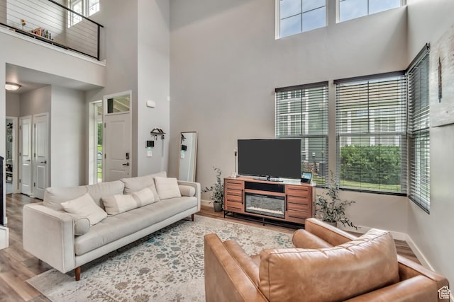 10363 S Silver Mine Rd, South Jordan, UT 84009 - living area featuring a towering ceiling and wood finished floors