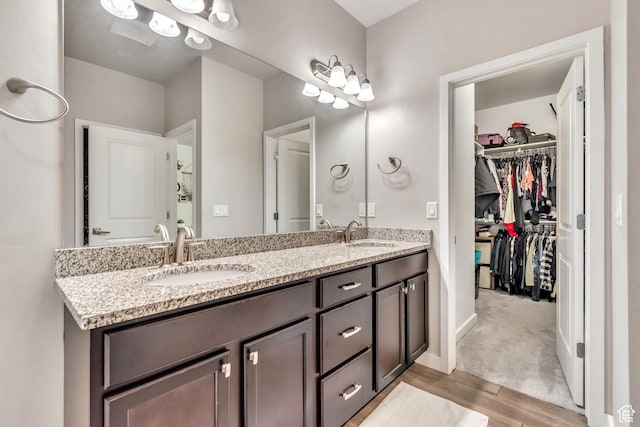 10363 S Silver Mine Rd, South Jordan, UT 84009 - bathroom with double vanity, wood finished floors, and a spacious closet