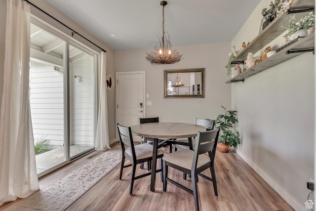 10363 S Silver Mine Rd, South Jordan, UT 84009 - dining room with light wood finished floors and a chandelier