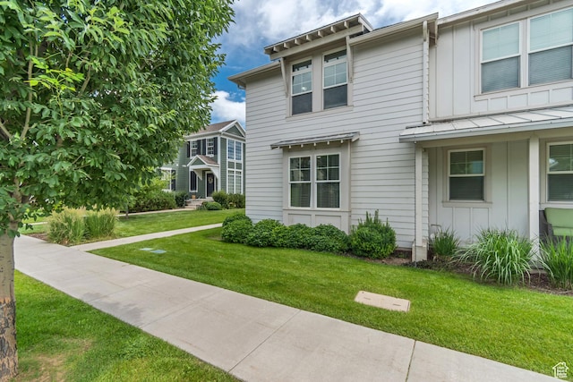 10363 S Silver Mine Rd, South Jordan, UT 84009 - view of front of home with board and batten siding and a front lawn