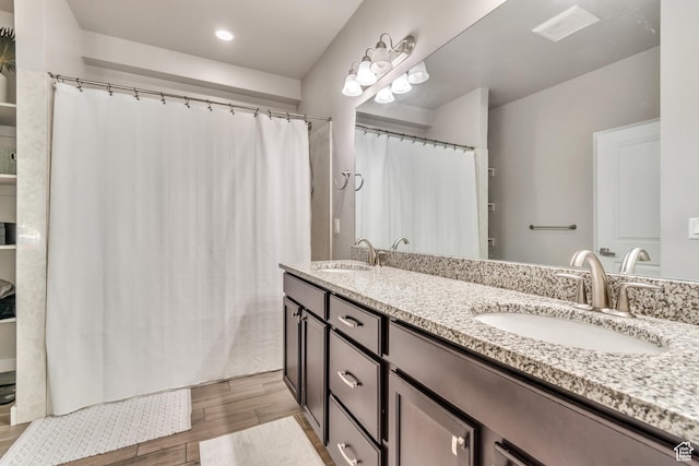 10363 S Silver Mine Rd, South Jordan, UT 84009 - bathroom with wood finished floors, double vanity, recessed lighting, and a shower with shower curtain