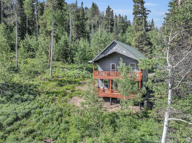 1624 Pine Cone Cir, Coalville, UT 84017 - rear view of house featuring a wooded view and a deck