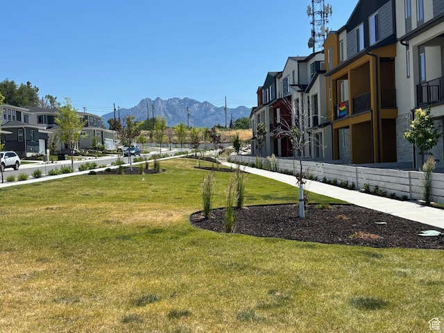 924 W Coalburn Way Unit 8-26, Murray, UT 84123 - surrounding community with a mountain view, a residential view, and a lawn