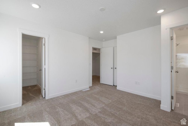 924 W Coalburn Way Unit 8-26, Murray, UT 84123 - unfurnished bedroom with a spacious closet, carpet, recessed lighting, and a closet