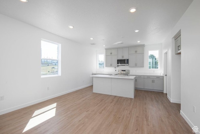 924 W Coalburn Way Unit 8-26, Murray, UT 84123 - kitchen with appliances with stainless steel finishes, gray cabinets, plenty of natural light, light countertops, and recessed lighting