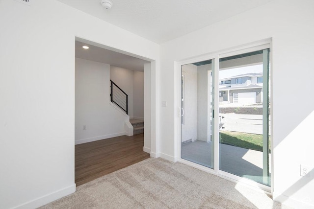 924 W Coalburn Way Unit 8-26, Murray, UT 84123 - carpeted empty room featuring a smoke detector and stairway