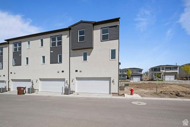 924 W Coalburn Way Unit 8-26, Murray, UT 84123 - rear view of house with an attached garage and stucco siding