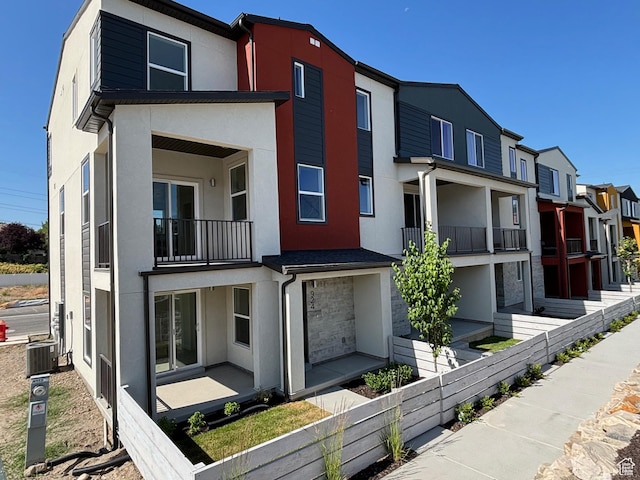 924 W Coalburn Way Unit 8-26, Murray, UT 84123 - view of front of house featuring stucco siding, a balcony, and a residential view