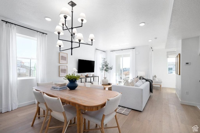 924 W Coalburn Way Unit 8-26, Murray, UT 84123 - dining area featuring a textured ceiling, light wood finished floors, a chandelier, and recessed lighting