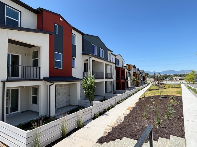 924 W Coalburn Way Unit 8-26, Murray, UT 84123 - view of side of property featuring stucco siding, a mountain view, and a residential view