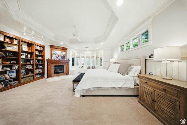 1734 E Spring Ln, Holladay, UT 84117 - carpeted bedroom with crown molding, a fireplace, a raised ceiling, and recessed lighting