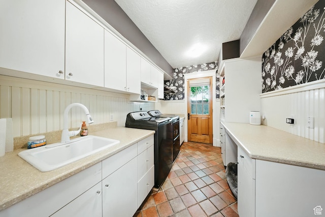 1734 E Spring Ln, Holladay, UT 84117 - washroom featuring independent washer and dryer, a wainscoted wall, wallpapered walls, cabinet space, and light tile patterned floors
