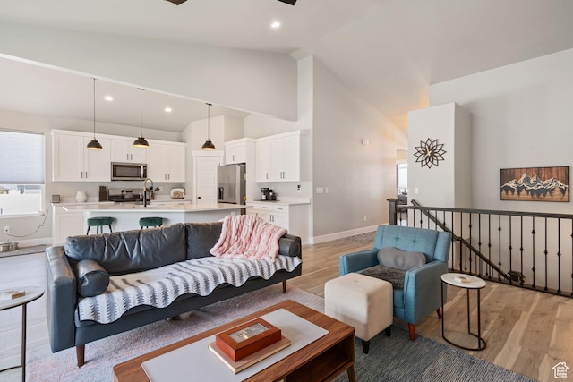 507 W 2030 N, Tooele, UT 84074 - living area featuring light wood-style floors, recessed lighting, and high vaulted ceiling