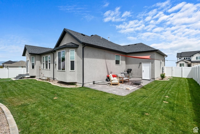 507 W 2030 N, Tooele, UT 84074 - back of house with a patio area, a fenced backyard, and stucco siding