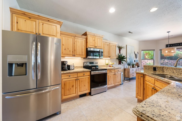 2469 W 840 N, Hurricane, UT 84737 - kitchen with appliances with stainless steel finishes, recessed lighting, light stone countertops, hanging light fixtures, and light tile patterned floors