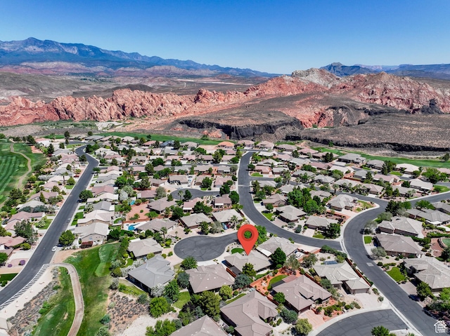 2469 W 840 N, Hurricane, UT 84737 - aerial view of property and surrounding area featuring a mountain backdrop and nearby suburban area