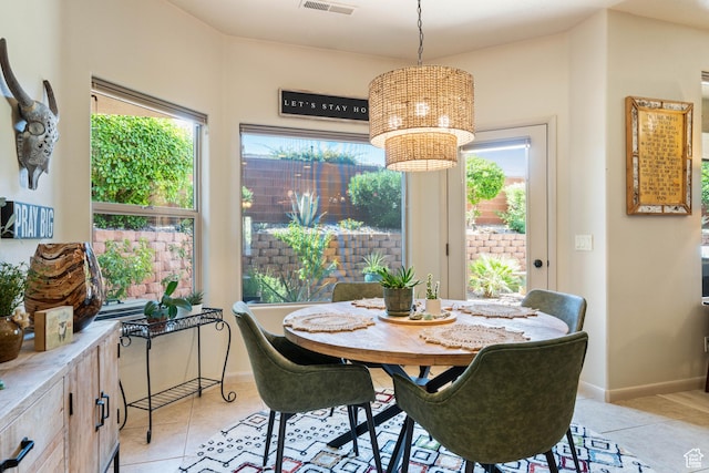 2469 W 840 N, Hurricane, UT 84737 - dining space with light tile patterned floors, healthy amount of natural light, and a chandelier