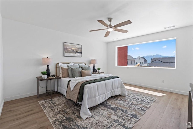 11568 S Watercourse Rd, South Jordan, UT 84009 - bedroom with wood finished floors and a ceiling fan