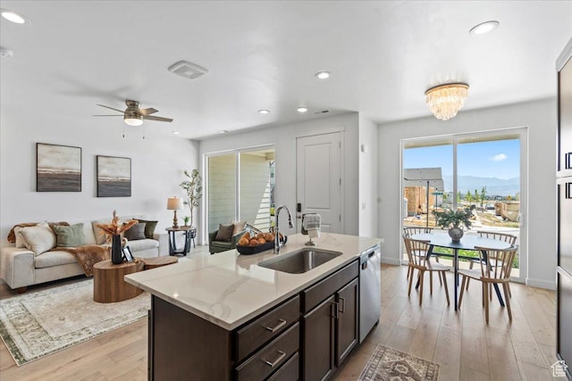 11568 S Watercourse Rd, South Jordan, UT 84009 - kitchen featuring dishwasher, light wood finished floors, dark brown cabinetry, open floor plan, and recessed lighting