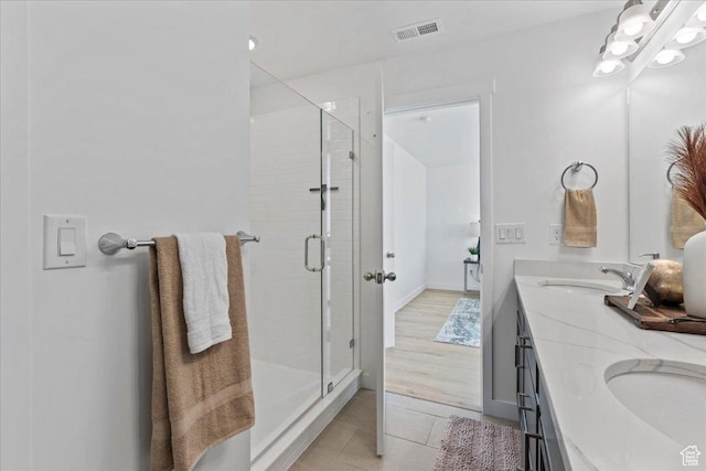 11568 S Watercourse Rd, South Jordan, UT 84009 - bathroom featuring a stall shower, double vanity, and tile patterned flooring