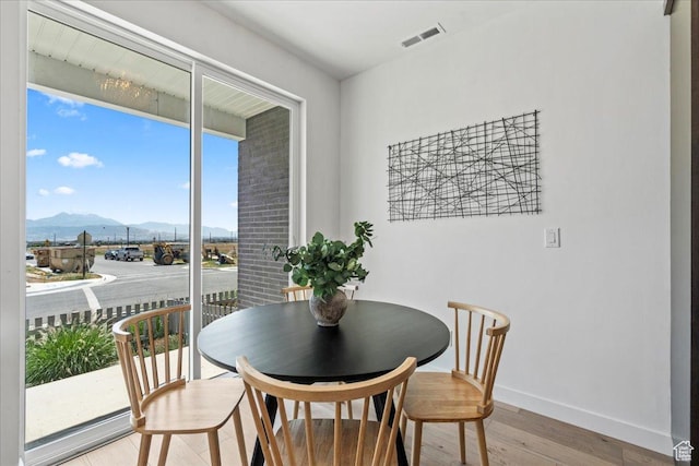 11568 S Watercourse Rd, South Jordan, UT 84009 - dining space with a mountain view and light wood-type flooring