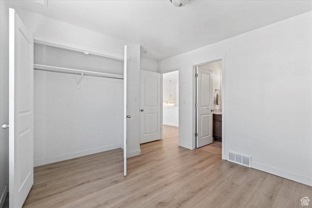 11568 S Watercourse Rd, South Jordan, UT 84009 - unfurnished bedroom featuring light wood-style floors and a closet