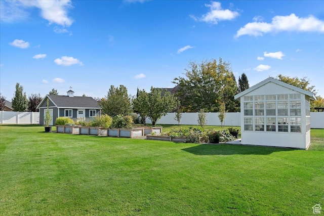 4987 S 5400 W, Hooper, UT 84315 - fenced backyard featuring a vegetable garden and a sunroom