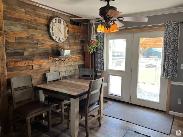1954 S 850 W, Preston, ID 83263 - dining room with ornamental molding, ceiling fan, wooden walls, and wood finished floors