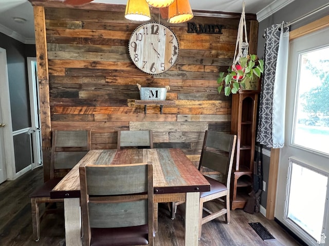 1954 S 850 W, Preston, ID 83263 - dining space featuring ornamental molding, wooden walls, plenty of natural light, and wood finished floors