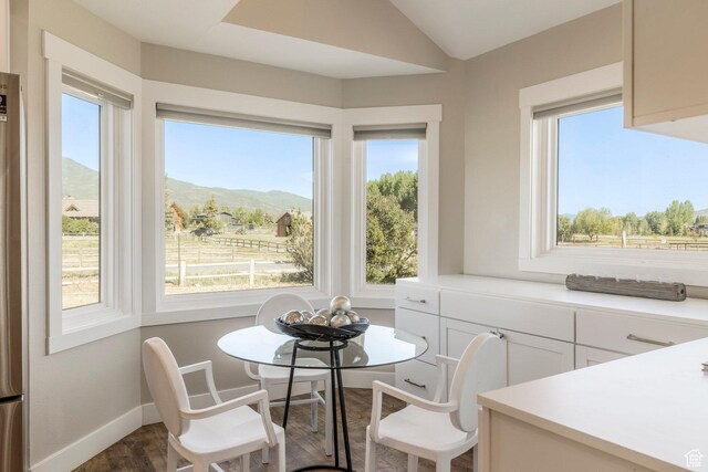 266 Old Ranch Rd W, Park City, UT 84098 - dining room featuring healthy amount of natural light, wood finished floors, a mountain view, and lofted ceiling