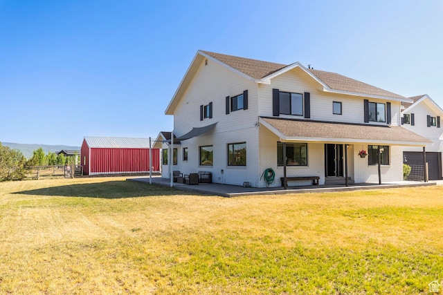 266 Old Ranch Rd W, Park City, UT 84098 - back of property featuring a patio, brick siding, and roof with shingles