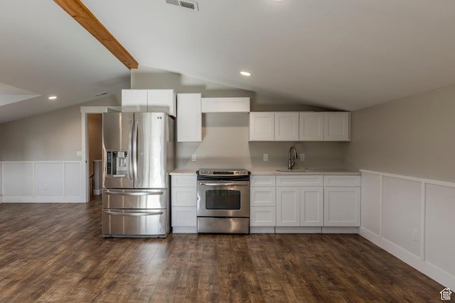 266 Old Ranch Rd W, Park City, UT 84098 - kitchen featuring appliances with stainless steel finishes, dark wood-style floors, a decorative wall, white cabinets, and light countertops