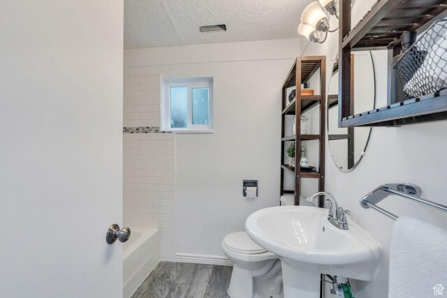 780 Loader Dr, Pleasant Grove, UT 84062 - full bathroom with a textured ceiling, wood finished floors, and shower / tub combination