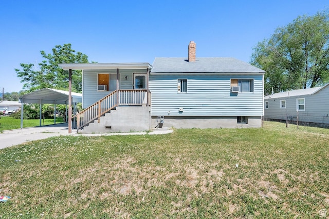 1579 S 1000 W, Salt Lake City, UT 84104 - view of front of home with a front lawn, a chimney, and a detached carport