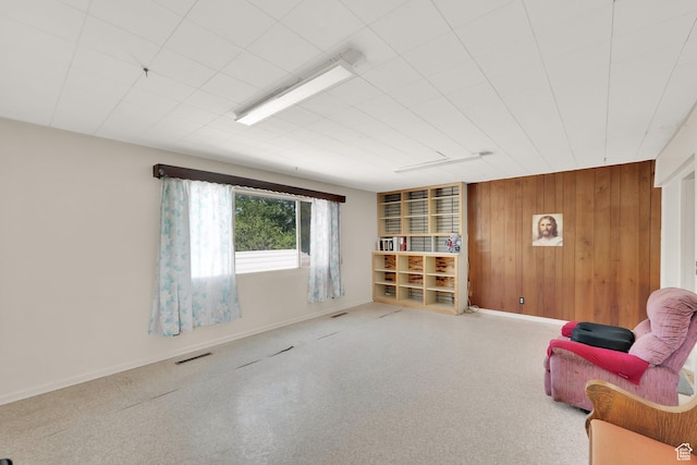 1579 S 1000 W, Salt Lake City, UT 84104 - living area with wooden walls and carpet flooring