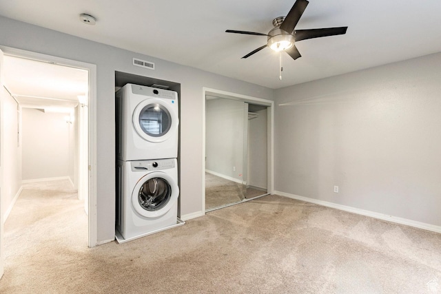 983 Mountain Willow Ln, Park City, UT 84098 - laundry room with stacked washing machine and dryer, carpet floors, and a ceiling fan
