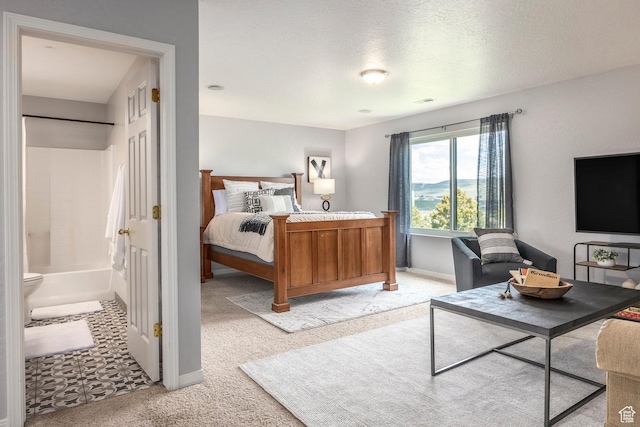 983 Mountain Willow Ln, Park City, UT 84098 - bedroom with light colored carpet, ensuite bath, and a textured ceiling