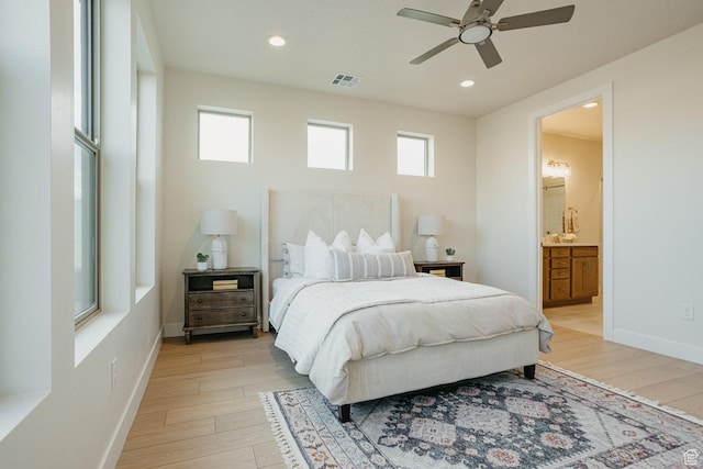 46 Rosalia Rdg, St George, UT 84770 - bedroom with multiple windows, light wood-type flooring, recessed lighting, and connected bathroom