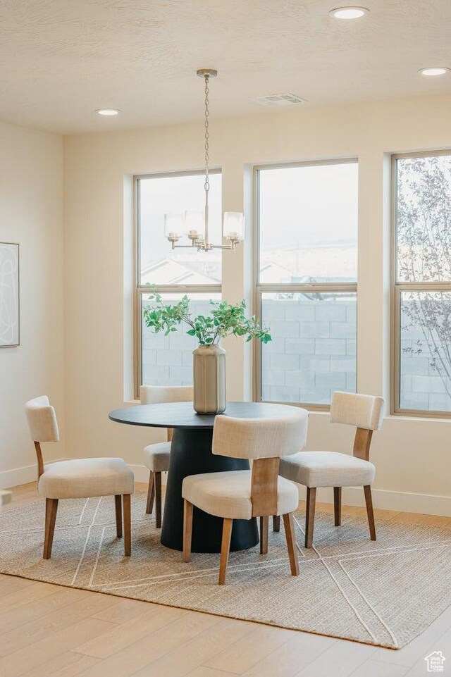 46 Rosalia Rdg, St George, UT 84770 - dining space featuring light wood-style floors, healthy amount of natural light, recessed lighting, and a chandelier