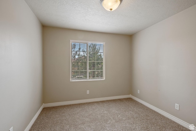 211 E Spencer Peak Way Unit H6, Draper, UT 84020 - spare room featuring carpet floors and a textured ceiling