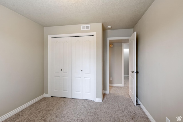 211 E Spencer Peak Way Unit H6, Draper, UT 84020 - unfurnished bedroom with carpet, a textured ceiling, and a closet
