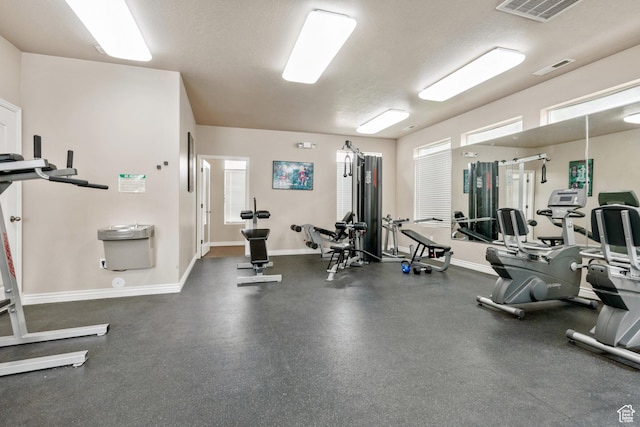 211 E Spencer Peak Way Unit H6, Draper, UT 84020 - exercise room featuring a textured ceiling