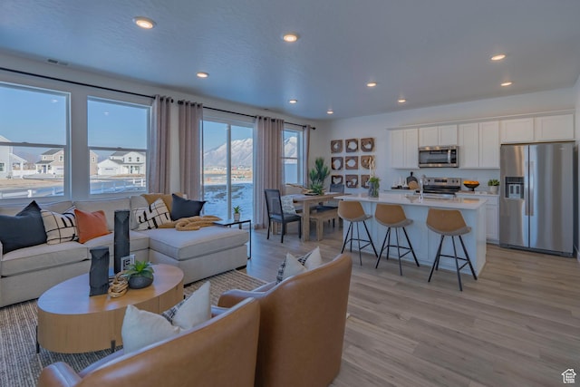 1710 N 784 W, Salem, UT 84653 - living area with light wood-style floors and recessed lighting