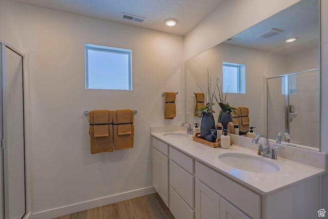 1710 N 784 W, Salem, UT 84653 - full bathroom featuring double vanity, a stall shower, and wood finished floors