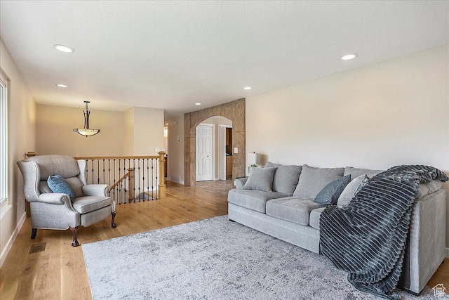315 E 900 N, Brigham City, UT 84302 - living room with light wood-style floors, arched walkways, and recessed lighting
