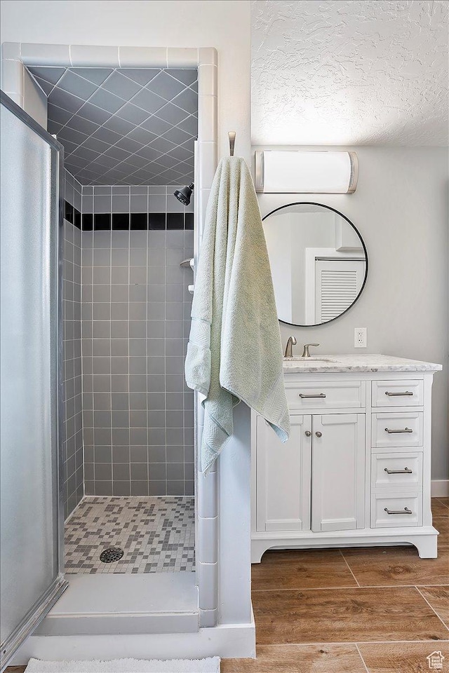 315 E 900 N, Brigham City, UT 84302 - full bath featuring a shower stall, vanity, and wood finished floors
