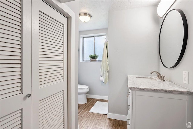 315 E 900 N, Brigham City, UT 84302 - bathroom with vanity, a closet, wood finished floors, and a textured ceiling