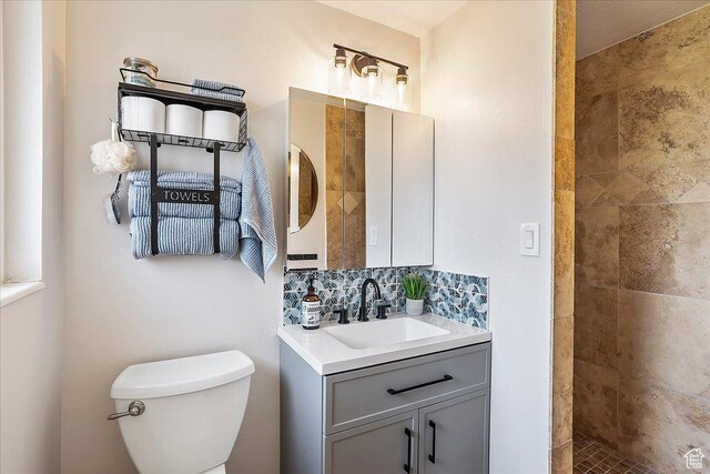 315 E 900 N, Brigham City, UT 84302 - bathroom with vanity, a tile shower, and backsplash