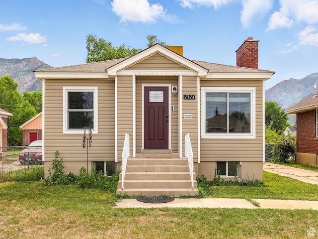 1116 S Liberty Ave, Ogden, UT 84404 - view of front facade with a mountain view and a chimney